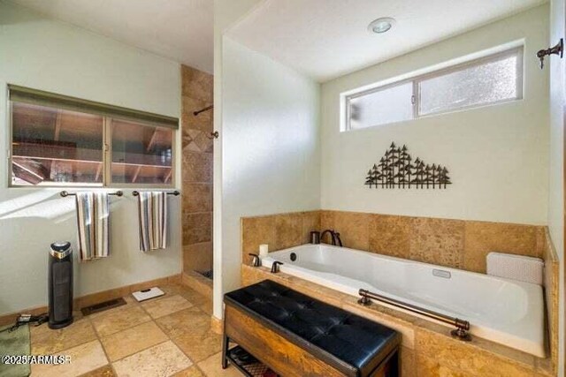 bathroom with plus walk in shower and plenty of natural light