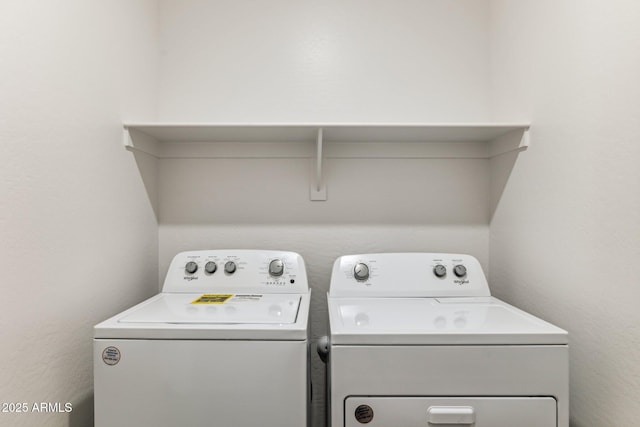 washroom with laundry area and washing machine and dryer