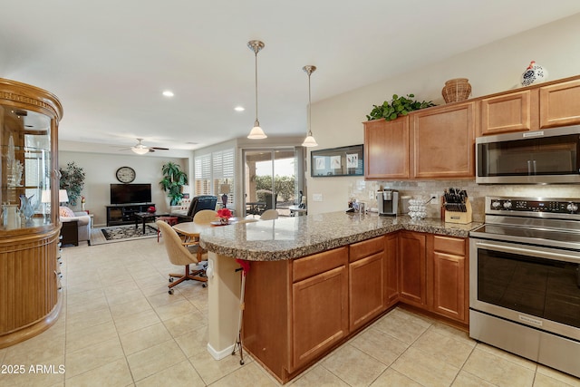 4245 E Ficus Way, Gilbert, AZ 85298 - kitchen with stainless steel appliances, light tile patterned flooring, backsplash, ceiling fan, and a peninsula
