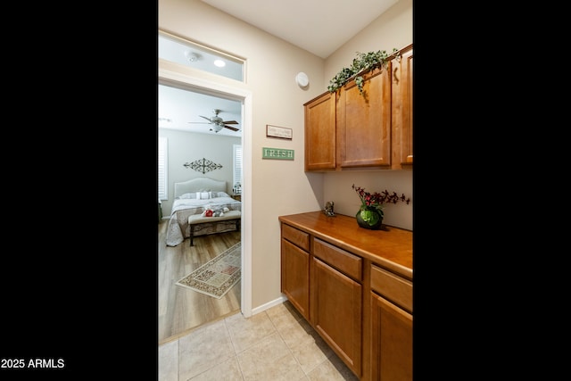 4245 E Ficus Way, Gilbert, AZ 85298 - bar area with ceiling fan, light tile patterned floors, and baseboards