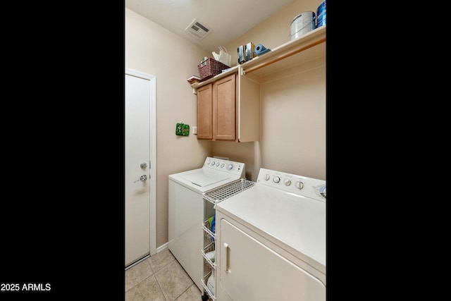 4245 E Ficus Way, Gilbert, AZ 85298 - laundry area featuring washer and dryer, cabinet space, light tile patterned flooring, and baseboards