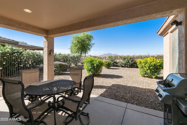 4245 E Ficus Way, Gilbert, AZ 85298 - view of patio / terrace featuring outdoor dining space, fence, a grill, and a mountain view