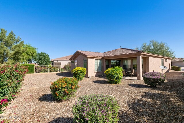 4245 E Ficus Way, Gilbert, AZ 85298 - rear view of property with a tiled roof, stucco siding, a patio, and fence