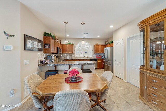 4245 E Ficus Way, Gilbert, AZ 85298 - dining room featuring light tile patterned floors, recessed lighting, and baseboards