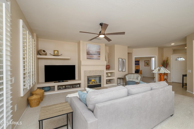 15134 W Waterford Dr, Surprise, AZ 85374 - living room featuring baseboards, ceiling fan, recessed lighting, light colored carpet, and a tile fireplace