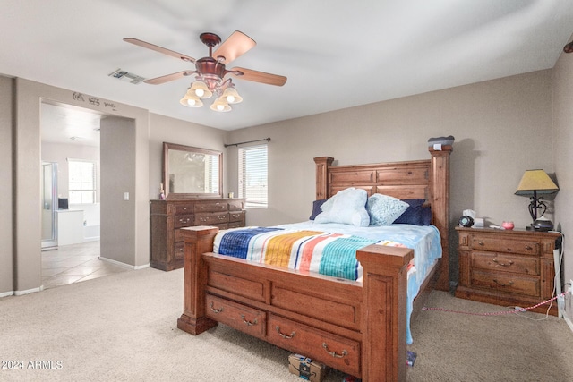 bedroom featuring light carpet, multiple windows, and ceiling fan