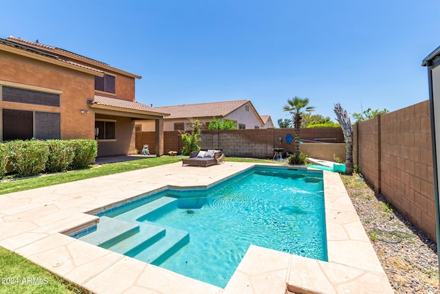 view of pool featuring a patio