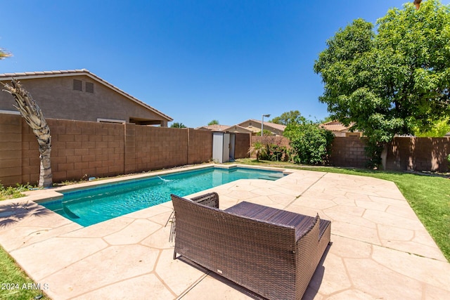 view of swimming pool with a patio area