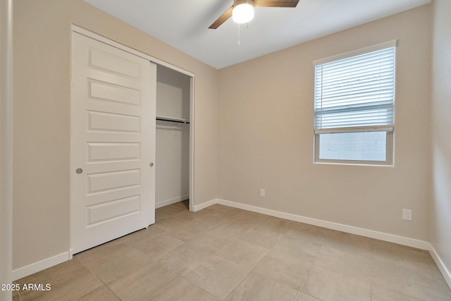 unfurnished bedroom with a closet and ceiling fan