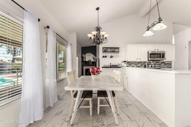 6156 W Del Rio St, Chandler, AZ 85226 - dining area with light marble finish floors, healthy amount of natural light, a chandelier, beam ceiling, and high vaulted ceiling