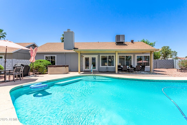 6156 W Del Rio St, Chandler, AZ 85226 - view of pool with french doors, a patio, cooling unit, and a hot tub