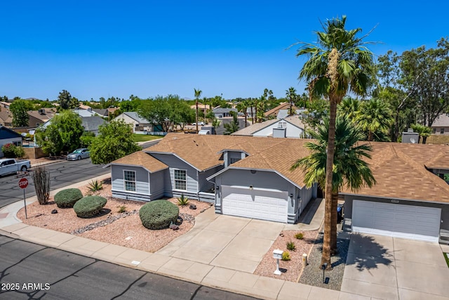 6156 W Del Rio St, Chandler, AZ 85226 - view of front of home featuring a garage, driveway, a residential view, roof with shingles, and stucco siding