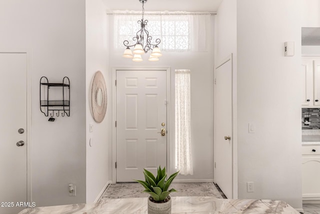 6156 W Del Rio St, Chandler, AZ 85226 - foyer entrance with a chandelier and baseboards