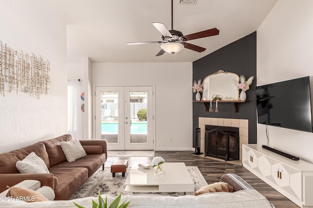 6156 W Del Rio St, Chandler, AZ 85226 - living room featuring dark wood-style floors, french doors, a ceiling fan, a fireplace, and baseboards