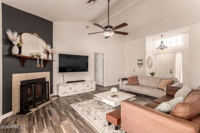 6156 W Del Rio St, Chandler, AZ 85226 - living room featuring dark wood finished floors, a fireplace, ceiling fan, beamed ceiling, and high vaulted ceiling