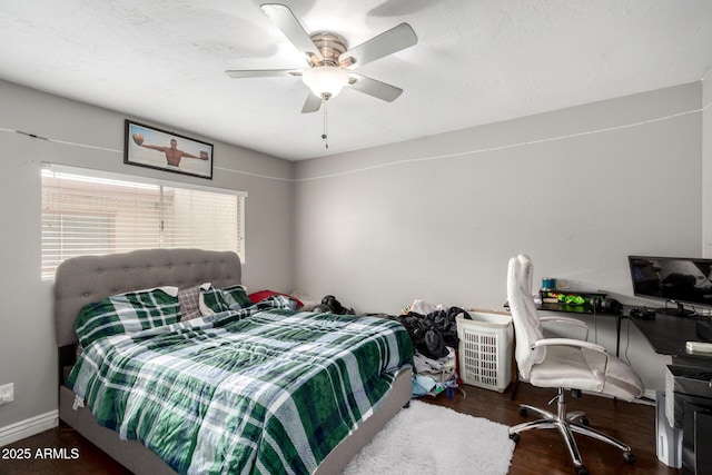 bedroom featuring ceiling fan and wood finished floors