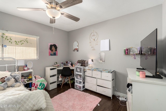 bedroom with baseboards, dark wood-style flooring, and a ceiling fan