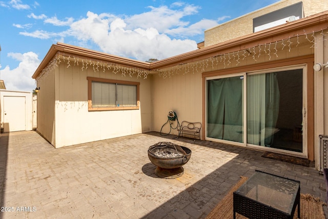 view of patio / terrace featuring a fire pit