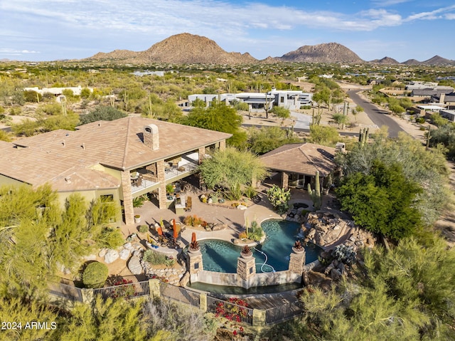 birds eye view of property featuring a mountain view