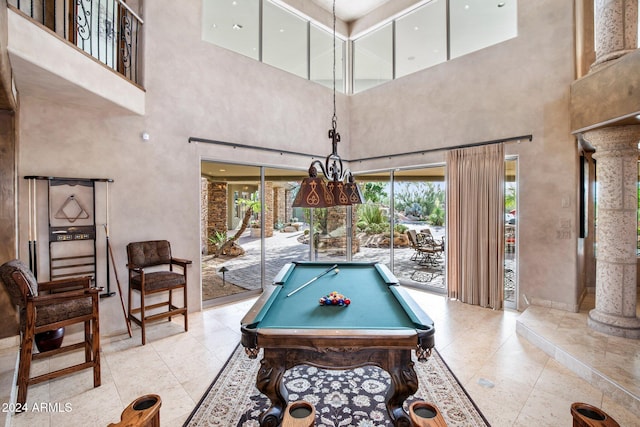 rec room with a high ceiling and pool table