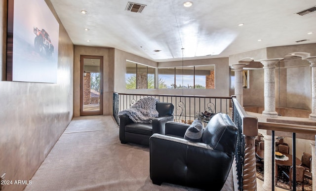 living room with light carpet and a wealth of natural light