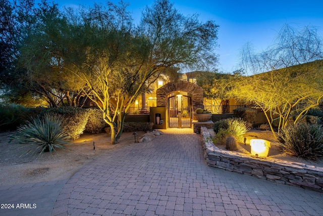 view of patio terrace at dusk