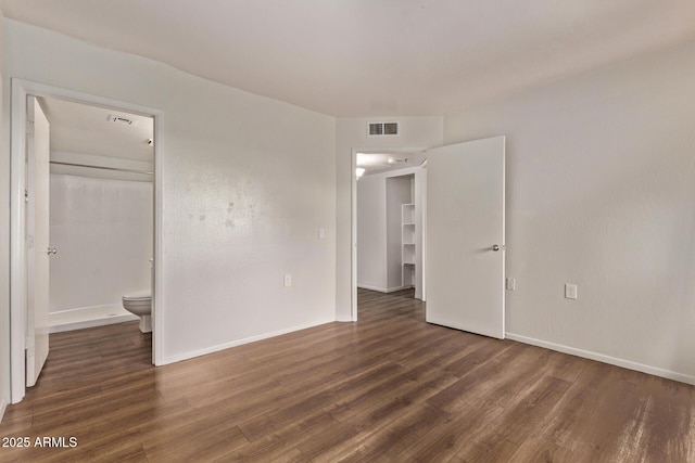 12221 W Bell Rd Unit 249, Surprise, AZ 85378 - unfurnished bedroom with wood finished floors and baseboards