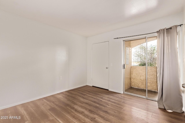 12221 W Bell Rd Unit 249, Surprise, AZ 85378 - unfurnished room featuring wood finished floors and baseboards