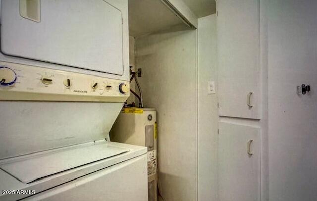 12221 W Bell Rd Unit 249, Surprise, AZ 85378 - clothes washing area with stacked washer / drying machine and water heater