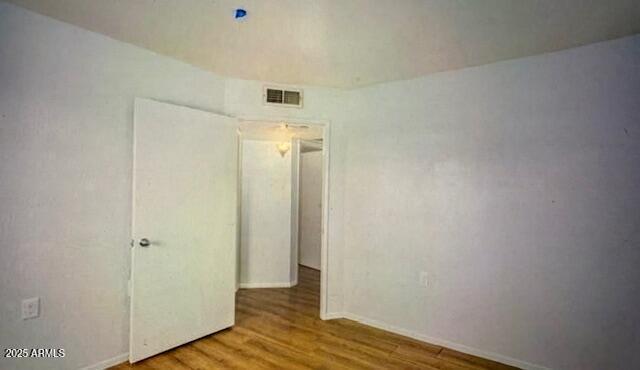 12221 W Bell Rd Unit 249, Surprise, AZ 85378 - empty room featuring wood finished floors and baseboards