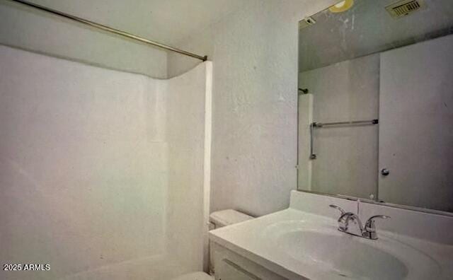 12221 W Bell Rd Unit 249, Surprise, AZ 85378 - bathroom with a shower, toilet, and vanity