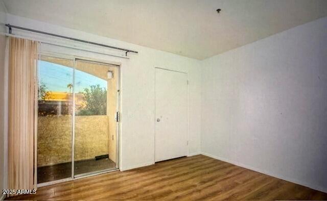 12221 W Bell Rd Unit 249, Surprise, AZ 85378 - doorway to outside featuring wood finished floors