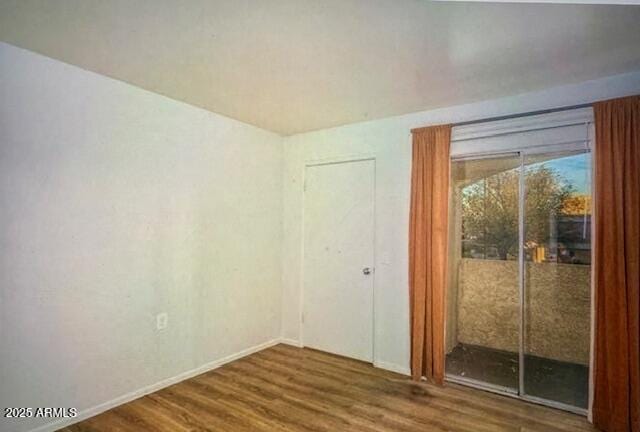 12221 W Bell Rd Unit 249, Surprise, AZ 85378 - unfurnished room featuring wood finished floors and baseboards