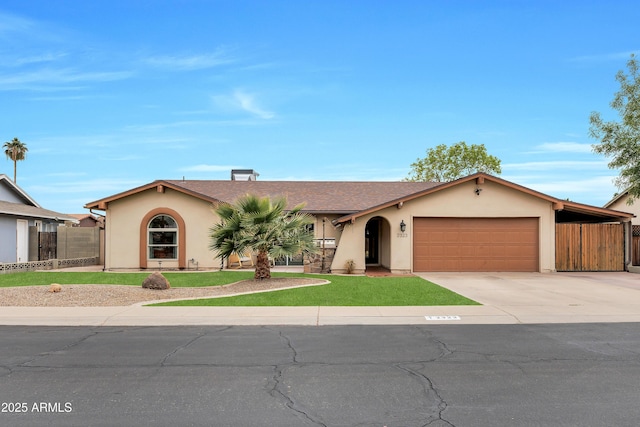 ranch-style house featuring a garage and a carport