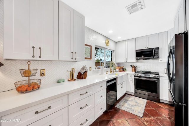 kitchen featuring tasteful backsplash, white cabinetry, sink, and black appliances