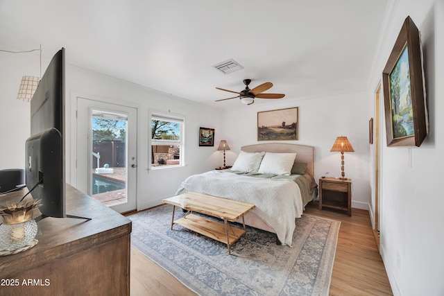 bedroom with ceiling fan, access to exterior, and light hardwood / wood-style flooring