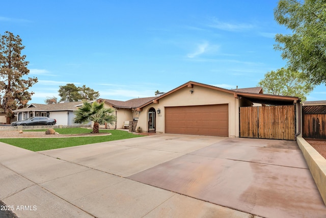 single story home featuring a garage and a front lawn