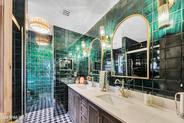 bathroom featuring vanity and tile walls