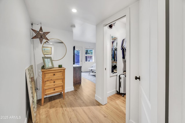 corridor featuring light hardwood / wood-style floors