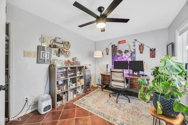 office area featuring ceiling fan and dark tile patterned floors