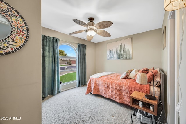 bedroom featuring ceiling fan and light colored carpet