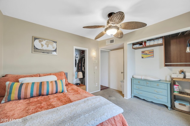 bedroom featuring light carpet, ceiling fan, and a closet