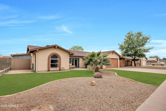 ranch-style home featuring a garage and a front yard