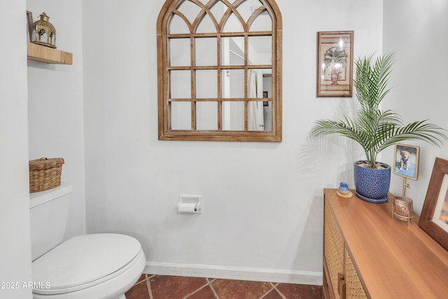 bathroom featuring tile patterned floors and toilet