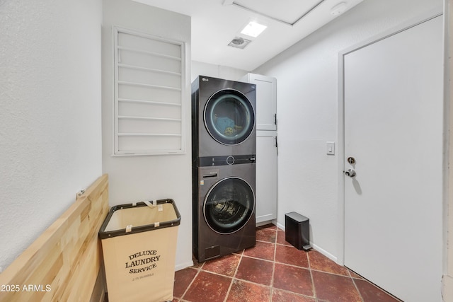 laundry room with stacked washer and dryer