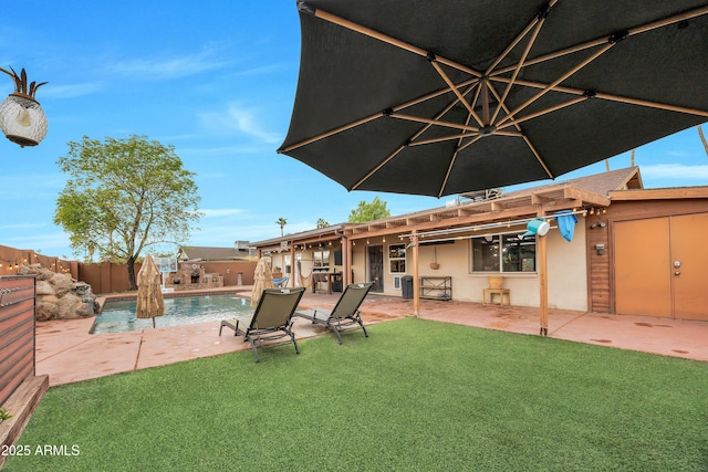 view of yard featuring a fenced in pool and a patio area