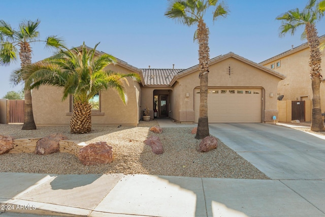 mediterranean / spanish-style home featuring a garage