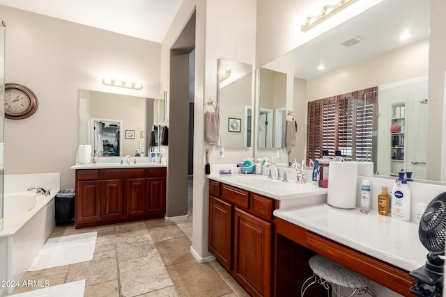 bathroom featuring a washtub and vanity