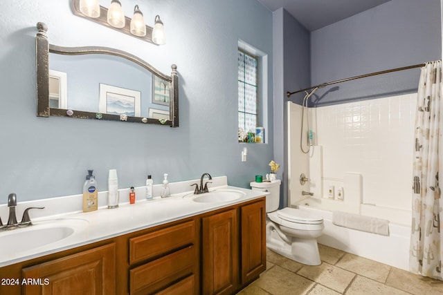 full bathroom featuring toilet, vanity, and shower / tub combo with curtain