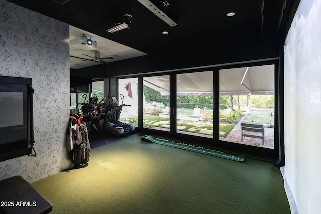 exercise room with ceiling fan